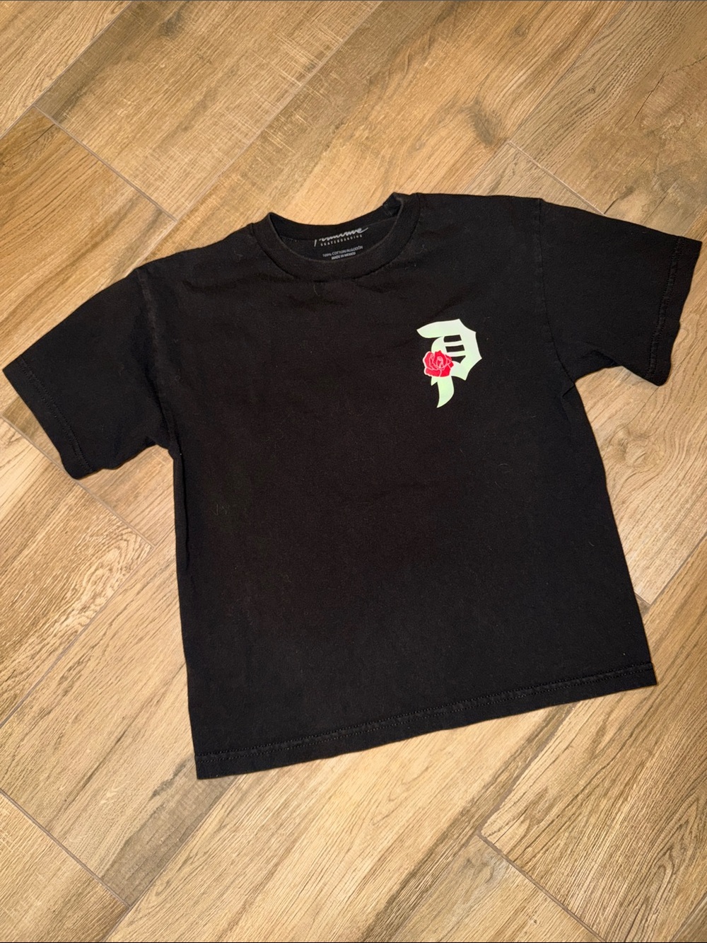 Primitive Skateboarding black cotton t-shirt with white rose graphic